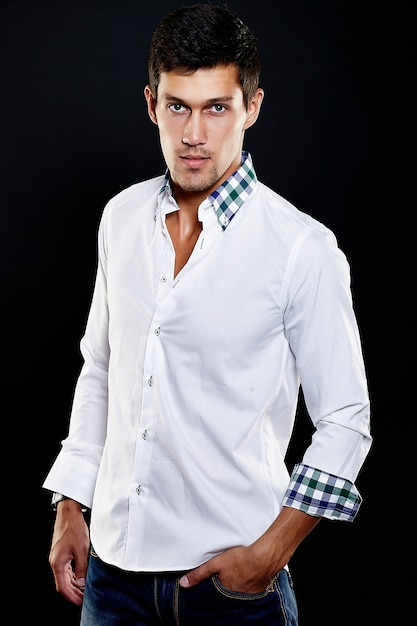 Fashion portrait of young caucasian man. Handsome model in casual clothes posing in studio. Attractive male