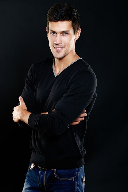 Fashion portrait of young caucasian man. Handsome model in casual clothes posing in studio. Attractive male