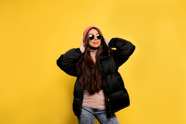 Fashion pretty cool girl in black jacket and sunglasses