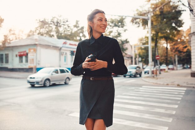 Fashion pretty woman walking through the streets of Old City