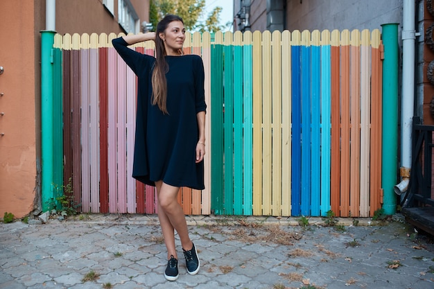 Fashion pretty woman walking through the streets of Old City