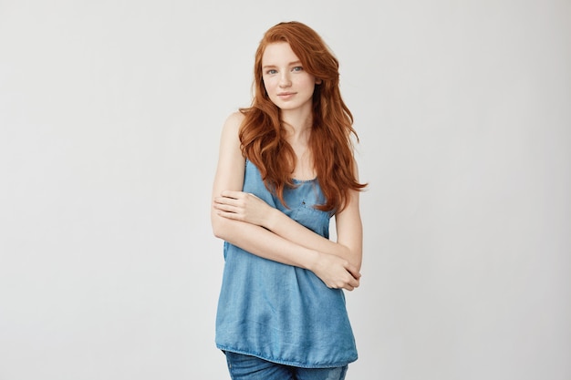 Fashion redhead model posing smiling.