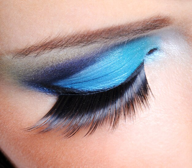 Fashion saturated make-up with long false eyelashes