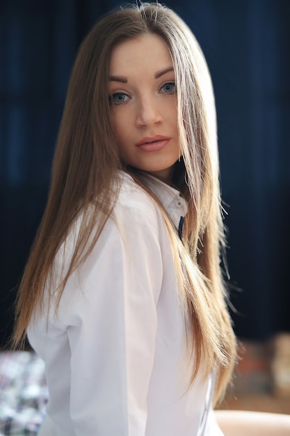 Fashion young woman posing at home in sensual pose