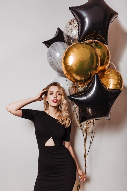 Fashionable blonde woman enjoying party