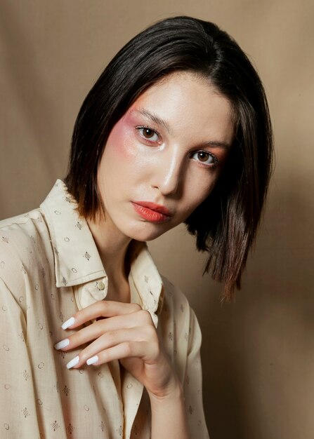 Fashionable brunette model in studio