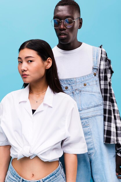 Fashionable couple posing in studio