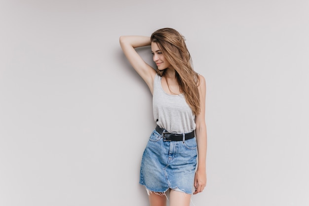 Download Free Stock Photo: Fashionable Dark-Haired Girl in Vintage Denim Skirt