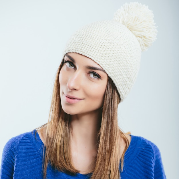 Fashionable girl in winter knitted clothes