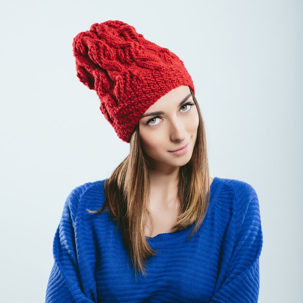 Fashionable girl in winter knitted clothes