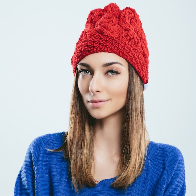 Fashionable girl in winter knitted clothes