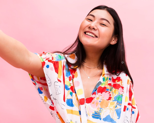 Fashionable woman taking a selfie