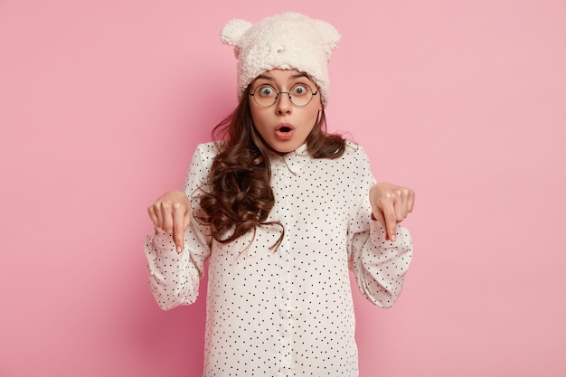 Fashionable woman wearing funny hat