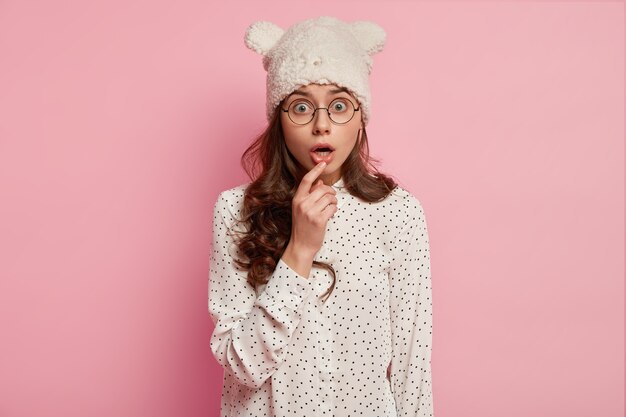 Fashionable woman wearing funny hat