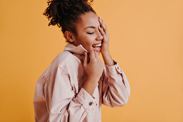 Fashionable young woman posing with closed eyes