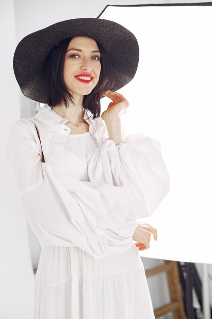 Fashionista girl. Woman on a white background. Stylish lady.