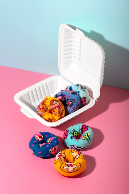Free photo fast fashion concept with materials and textiles disguised as donuts