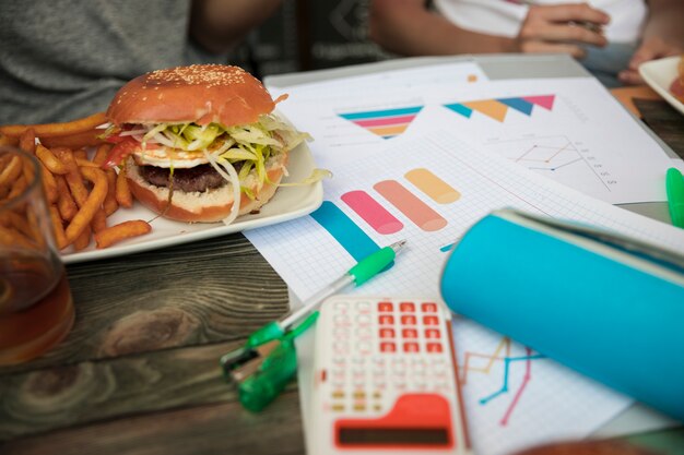 Fast food and diagrams on table