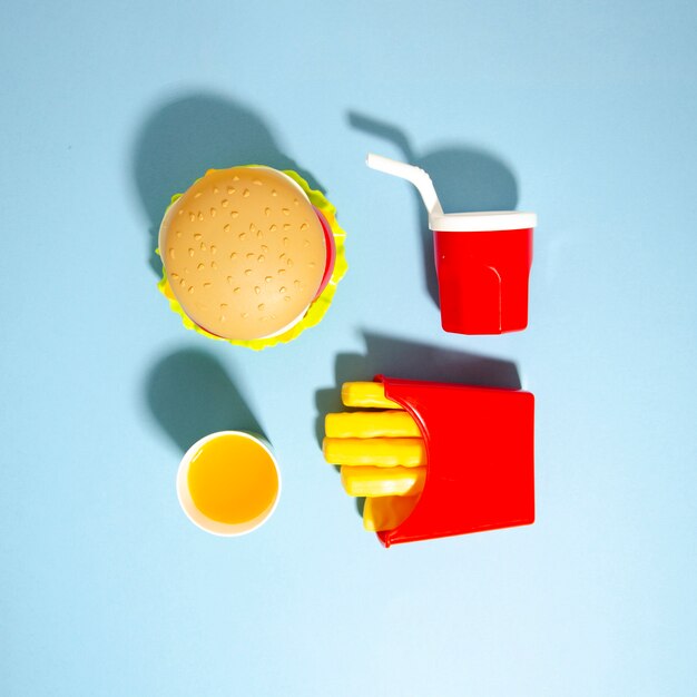 Fast food replicas on blue background