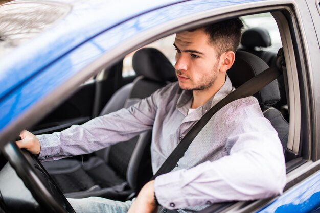 Fasten the car seat belt. Young man Safety belt safety first while driving