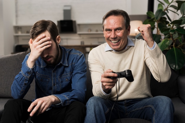 Father beating son at videogames