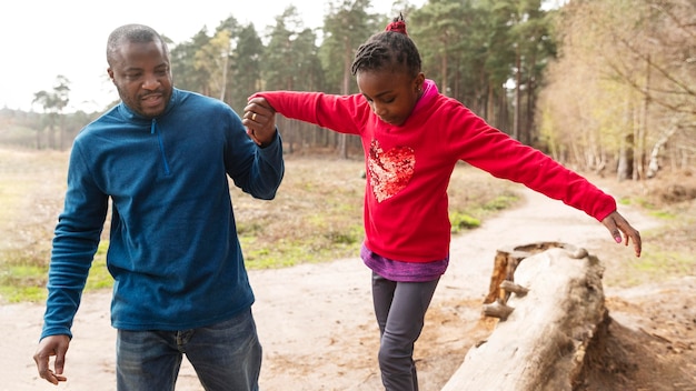 Free photo father and child having fun together outdoors