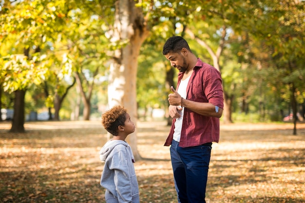 Father criticizing his disobedient child for bad behavior