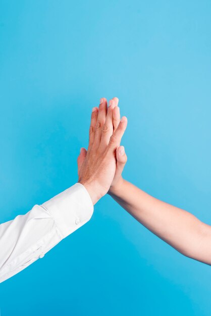 Father and daughter doing high five