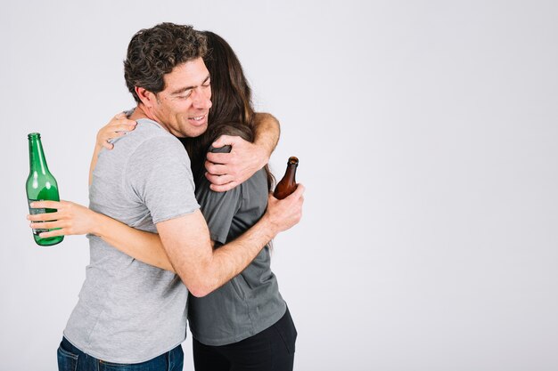 Father and daughter drinking beer and hugging