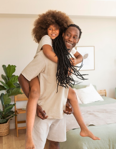 Free photo father and daughter having fun at home