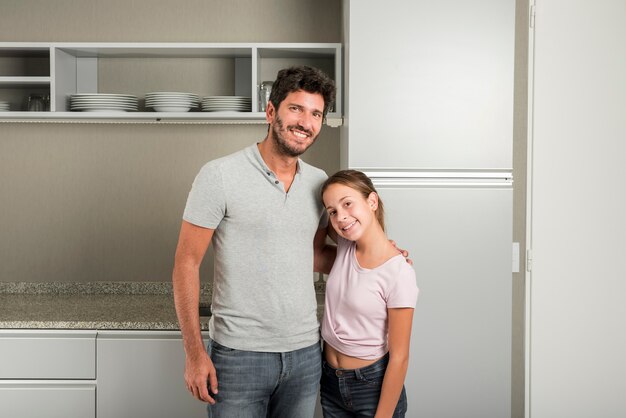 Father and daughter in kitchen on fathers day