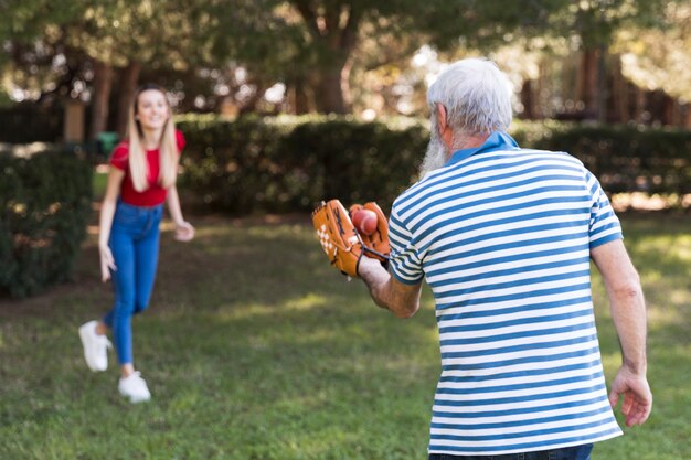 father and daughter playing baseball