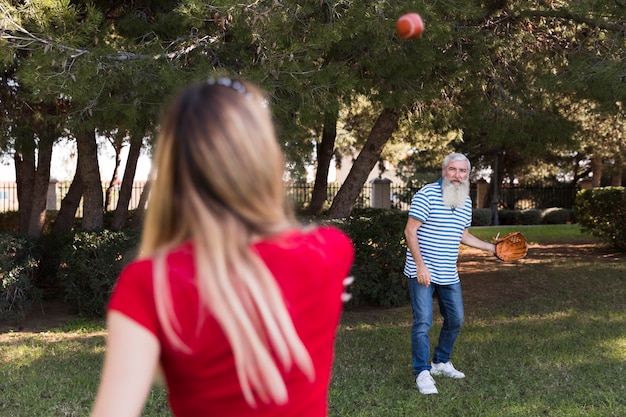 Free photo father and daughter playing baseball