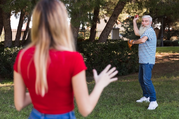 Father and daughter playing baseball