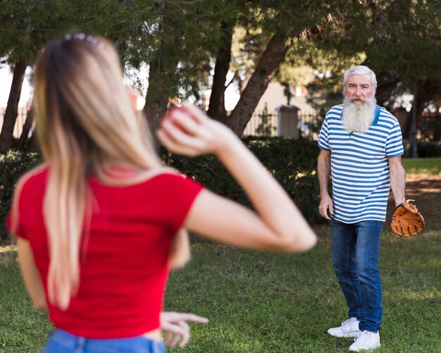 Free photo father and daughter playing baseball