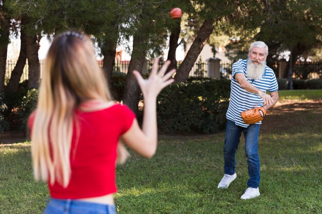 Father and daughter playing baseball