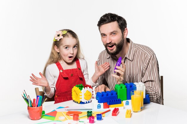 Father and daughter playing educational games together