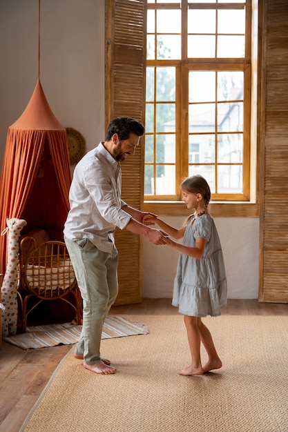 Father and daughter spending time together while wearing linen clothing