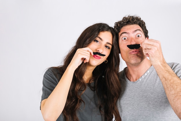 Free photo father and daughter with moustaches