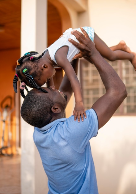 Father holding his little baby girl