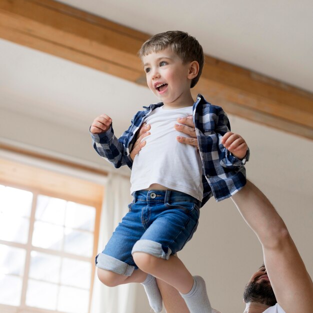 Father holding his son in the air