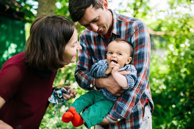 Father holding whimming child outside