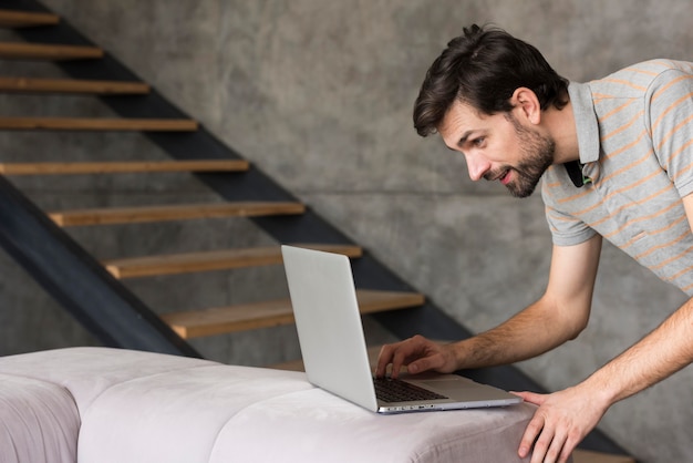 Father at home with laptop