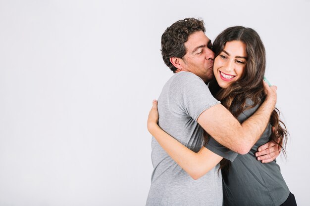 Father hugging daughter