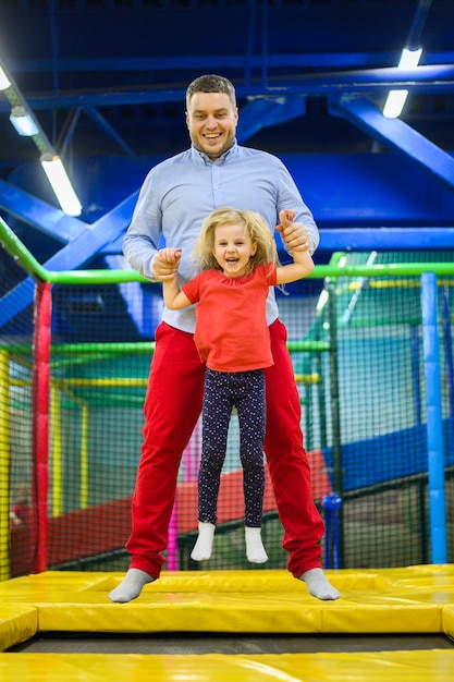 Father jumping with lovely daughter