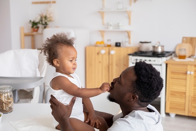 Free photo father and little daughter spending time together