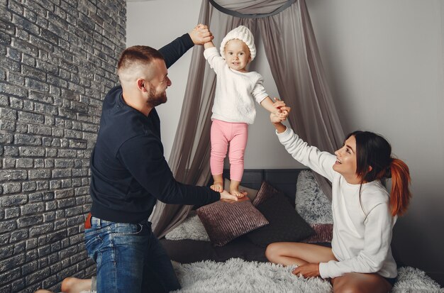 Father and mother with little daughter