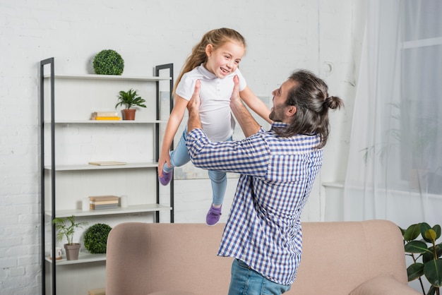 Father playing with her daughter