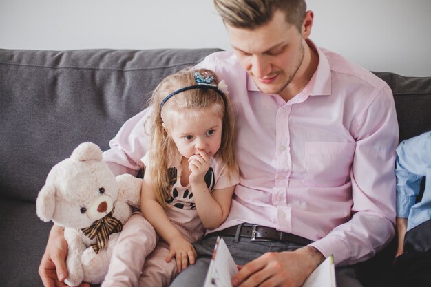 Father reading a story to his daughter