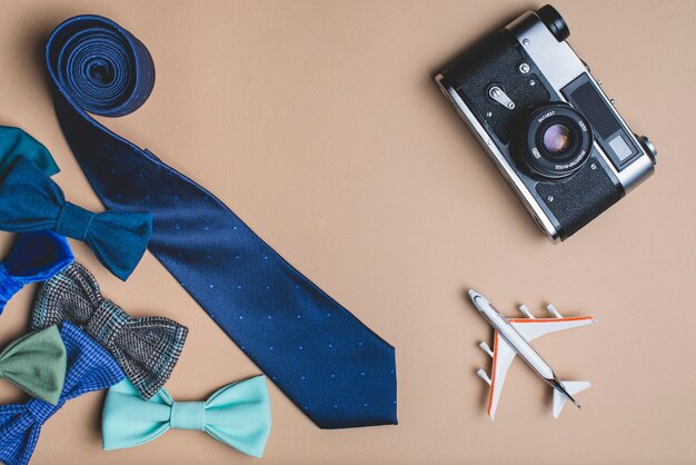 Father's day background with bow ties, tie and camera